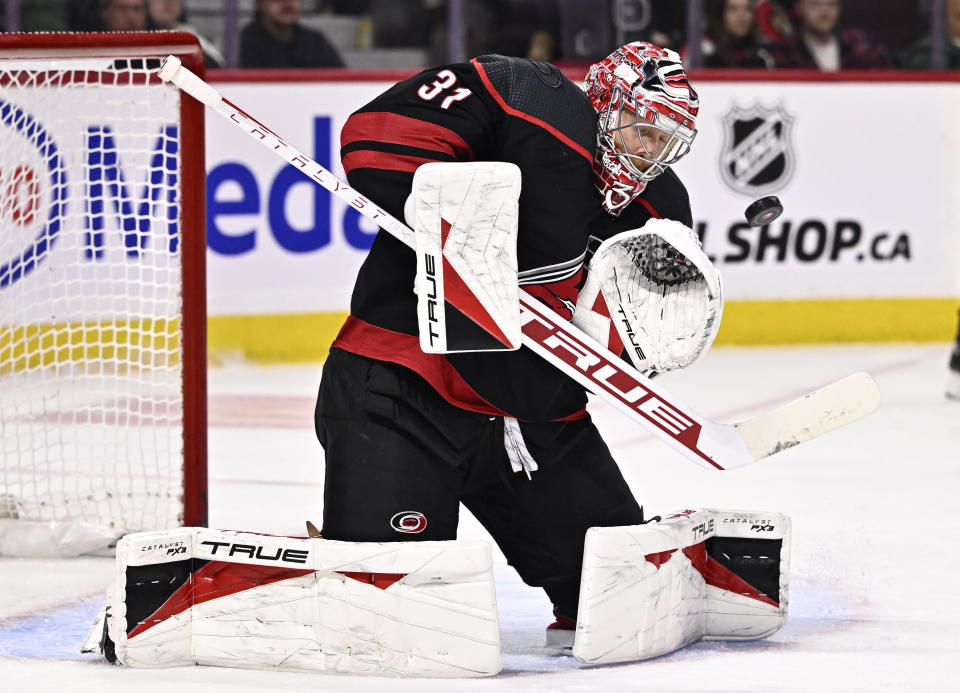 Carolina Hurricanes goaltender Frederik Andersen (31) makes a save during the second period of an NHL hockey game against the Ottawa Senators in Ottawa, Ontario, on Sunday, March 17, 2024. (Justin Tang/The Canadian Press via AP)