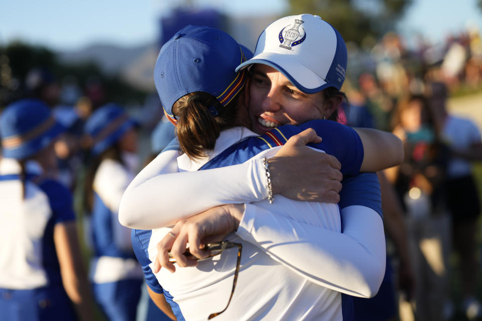 Europe's Carlota Ciganda, right hugs playing partner Europe's Linn Grant on the 17th green after they won their afternoon fourball match at the Solheim Cup golf tournament in Finca Cortesin, near Casares, southern Spain, Saturday, Sept. 23, 2023. Europe play the United States in this biannual women's golf tournament, which played alternately in Europe and the United States. (AP Photo/Bernat Armangue)