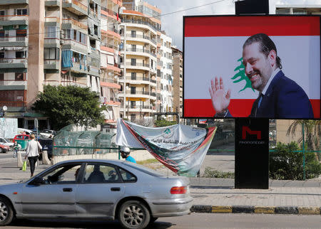 A billboard depicting Lebanon's Prime Minister Saad al-Hariri, who has resigned from his post, is seen in Beirut, Lebanon, November 11, 2017. REUTERS/Mohamed Azakir