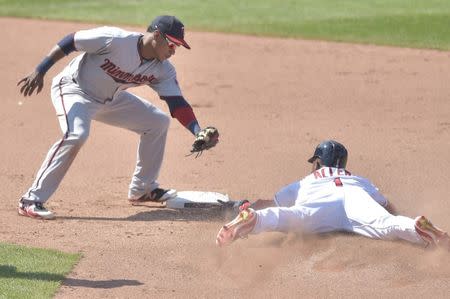 Aug 9, 2018; Cleveland, OH, USA; Cleveland Indians center fielder Greg Allen (1) steals second base beside Minnesota Twins shortstop Jorge Polanco (11) in the ninth inning at Progressive Field. Mandatory Credit: David Richard-USA TODAY Sports