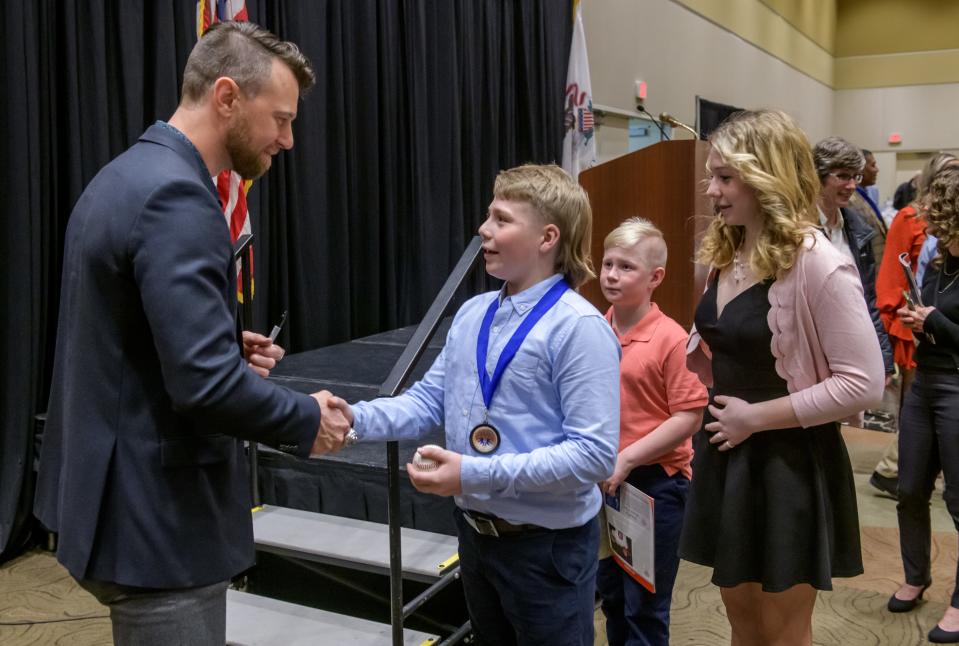 Former Chicago Cubs and Kansas City Royals star Ben Zobrist of Eureka greets some young fans during an autograph-signing session after the 2023 Greater Peoria Sports Hall of Fame induction ceremony Saturday, March 25, 2023 at the Peoria Civic Center.