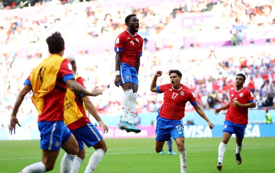 Costa Rica’s Keysher Fuller celebrates scoring their first goal with Yeltsin Tejeda and teammates v Japan (REUTERS)