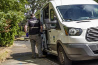 In this Sept. 2020 photo, Emergency Medical Technician (EMT) Christian Hawks with CAHOOTS, a mental health crisis intervention program, responds to a crisis call in Eugene, Ore. When police respond to a person gripped by a mental health or drug crisis, the encounter can have tragic results. Now a government health program will help communities set up an alternative: mobile teams of practitioners trained in de-escalating such potentially volatile situations. (William Holderfield via AP)