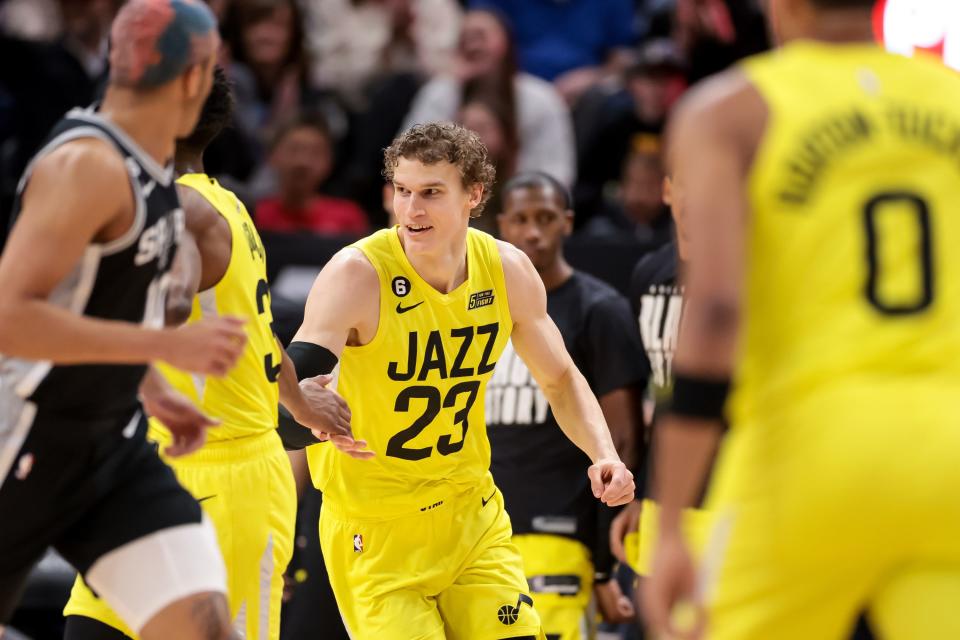 Utah Jazz forward Lauri Markkanen celebrates after a dunk during the game against the San Antonio Spurs .