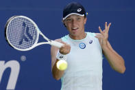 Iga Swiatek, of Poland, returns a shot to Jasmine Paolini, of Italy, during the first round of the US Open tennis championships, Tuesday, Aug. 30, 2022, in New York. (AP Photo/John Minchillo)