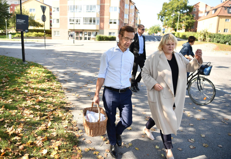 Ulf Kristersson, leader of the Moderate Party, walks with his wife Birgitta Ed to cast their votes in Strangnas, Sweden, Sunday Sept. 9, 2018. Polls have opened in Sweden's general election in what is expected to be one of the most unpredictable and thrilling political races in Scandinavian country for decades amid heated discussion around top issue immigration. (Erik Simander/TT via AP)