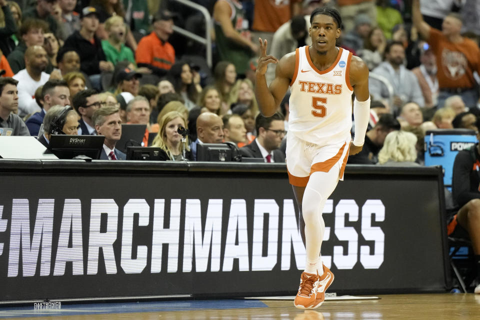 Texas guard Marcus Carr celebrates after scoring against Miami in the first half of an Elite 8 college basketball game in the Midwest Regional of the NCAA Tournament Sunday, March 26, 2023, in Kansas City, Mo. (AP Photo/Jeff Roberson)