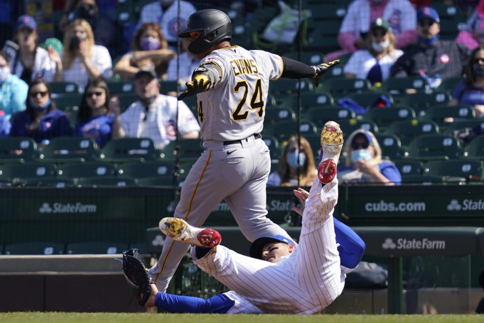 Pittsburgh Pirates' Phillip Evans (24) is put out at first by Chicago Cubs first baseman Anthony Rizzo during the fourth inning of a baseball game in Chicago, Sunday, April 4, 2021. (AP Photo/Nam Y. Huh)