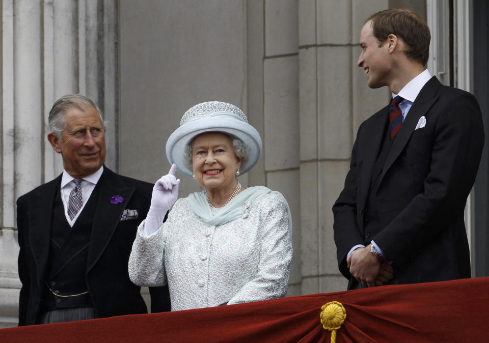 FILE - Britain's Prince Charles, Britain's Queen Elizabeth II and Prince William stand on the balcony at Buckingham Palace during the Diamond Jubilee celebrations in central London, June 5, 2012. Queen Elizabeth II, Britain’s longest-reigning monarch and a rock of stability across much of a turbulent century, has died. She was 96. Buckingham Palace made the announcement in a statement on Thursday Sept. 8, 2022 (AP Photo/Stefan Wermuth, Pool, File)