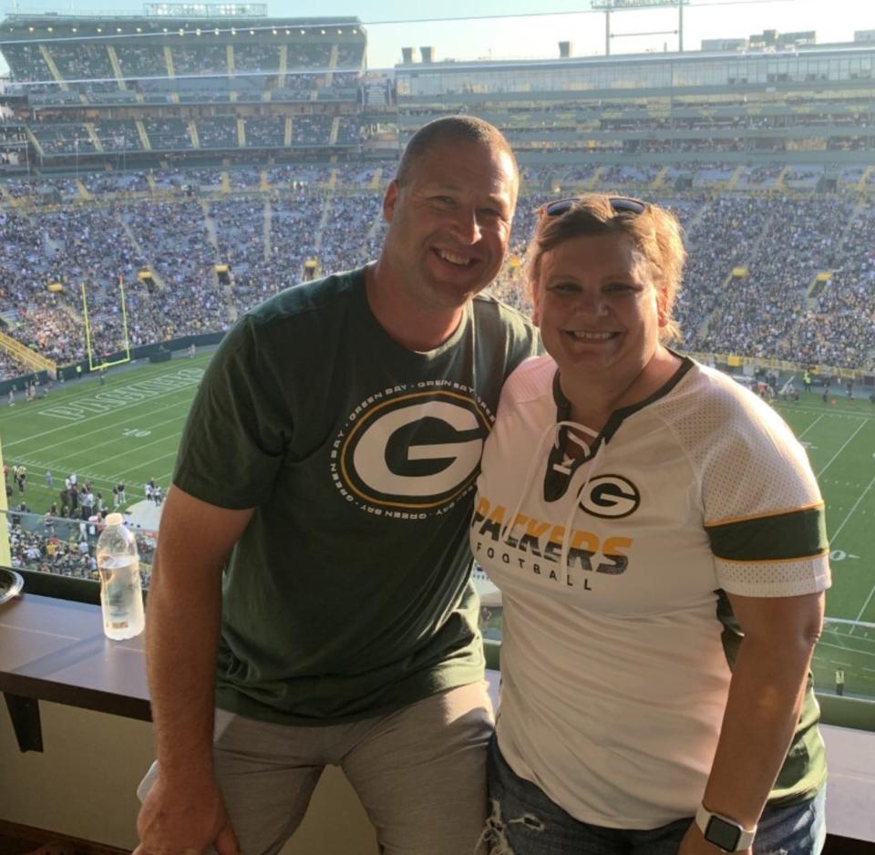 Corey and Michelle Hensel at a Green Bay Packers game. Michelle was finally plucked off the season-ticket waiting list after a 47-year wait.