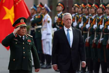 U.S. Secretary of Defense Jim Mattis (R) and Vietnam's Defence Minister Ngo Xuan Lich review the guard of honour during a welcoming ceremony in Hanoi, Vietnam January 25, 2018. REUTERS/Kham