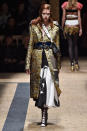 Prada’s gold brocade coat. (Photo by Catwalking/Getty Images)