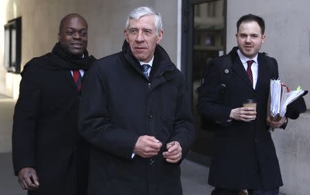 Former British foreign minister Jack Straw (C) leaves a BBC building in central London February 23, 2015. REUTERS/Paul Hackett