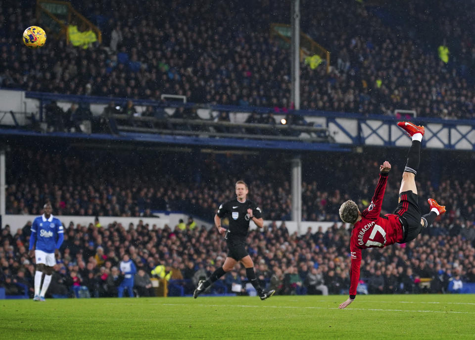 Manchester United's Alejandro Garnacho scores their side's first goal of the game with an overhead kick during their English Premier League soccer match against Everton at Goodison Park, Liverpool, England, Sunday, Nov. 26, 2023. (Peter Byrne/PA via AP)