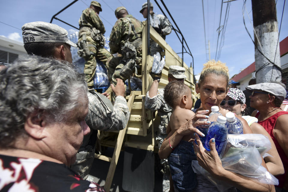 National Guard soldiers distribute water and food to residents of Puerto Rico, Sept. 24, 2017. 