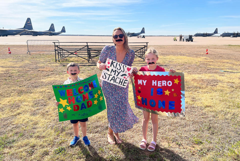 Maxine Clegg with her kids, Maddie and Ethan, wait to welcome home Lt. Col. Nate Clegg. (Courtesy Maxine Clegg)