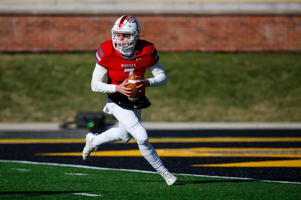 Reeds Spring quarterback Blandy Burall looks for an open receiver as the Wolves took on the Cardinal Ritter Lions during a state championship game at Faurot Field in Columbia, Mo. on Saturday, Dec. 3, 2022.