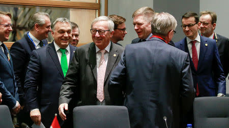 European Commission President Jean-Claude Juncker, Hungarian Prime Minister Victor Orban and Polish Prime Minister Mateusz Morawiecki attend the Visegrad Group meeting in Brussels, Belgium, December 14, 2017. REUTERS/Olivier Hoslet/Pool