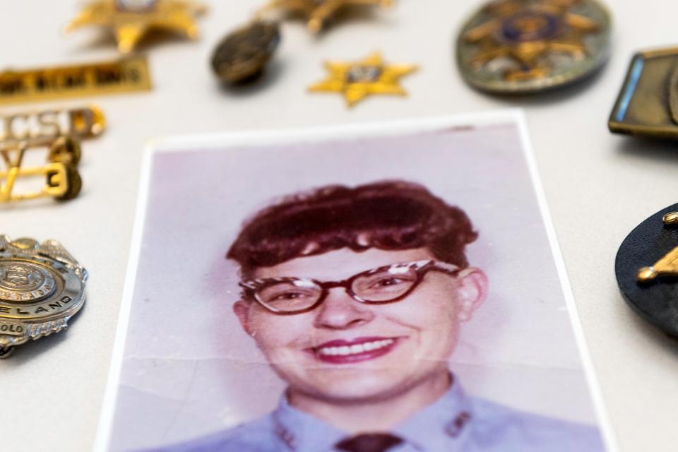 A photograph of Wilma Davis, the first female deputy for the Larimer County Sheriff's Office, sits on a desk at the sheriff's office in Fort Collins on March 19. Davis died in February.