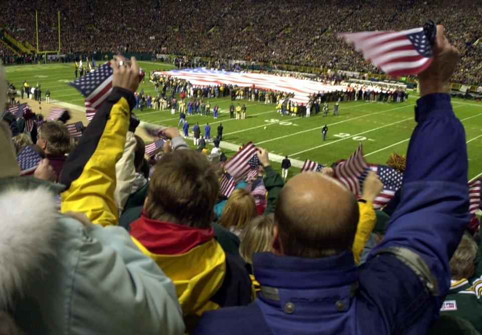 Green Bay Packers fans show their patriotic spirit during pregame cermeonies before their game against the Washington Redskins Monday, September 24, 2001 at Lambeau Field in Green Bay, Wis.