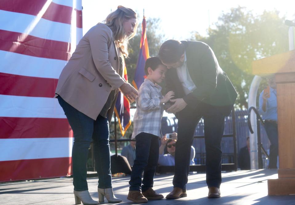 Rep. Ruben Gallego takes the stage with his his wife, Sydney, and son Michael to speak during a public rally at Grant Park in Phoenix on Jan. 28, 2023, kicking off his U.S. Senate campaign.
