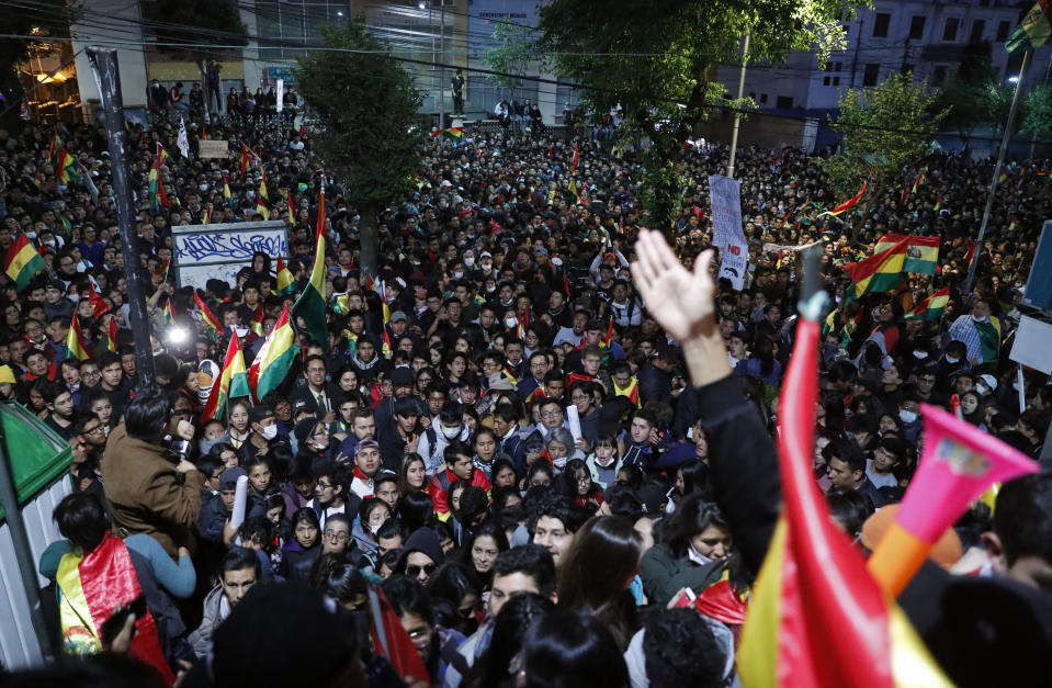 Anti-government protesters march against early presidential election results in La Paz, Bolivia, Tuesday, Oct. 22, 2019. International election monitors expressed concern over Bolivia's presidential election process Tuesday after an oddly delayed official quick count showed President Evo Morales near an outright first-round victory — even as a more formal tally tended to show him heading for a risky runoff. (AP Photo/Jorge Saenz)