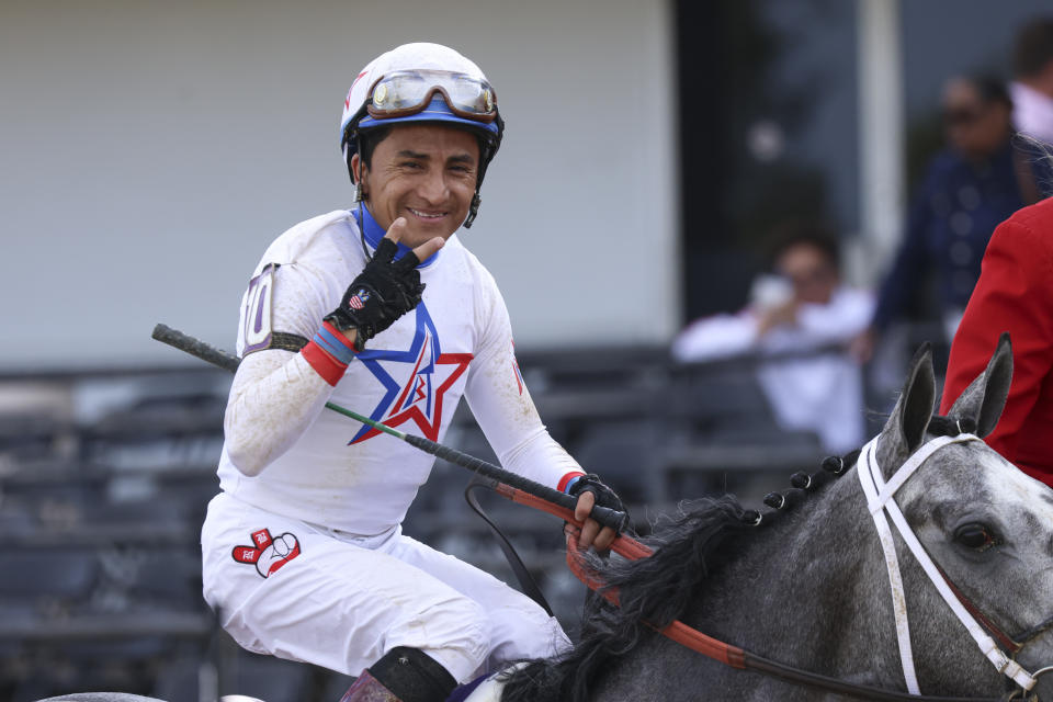 Rafael Bejarano, atop Taxed, reacts after winning the 98th running of the Black-Eyed Susan horse race at Pimlico Race Course, Friday, May 19, 2023, in Baltimore. (AP Photo/Julia Nikhinson)