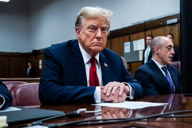 <p> Jabin Botsford-Pool/Getty</p> Former President Donald Trump sits in a courtroom at the onset of his Manhattan criminal trial on April 15, 2024