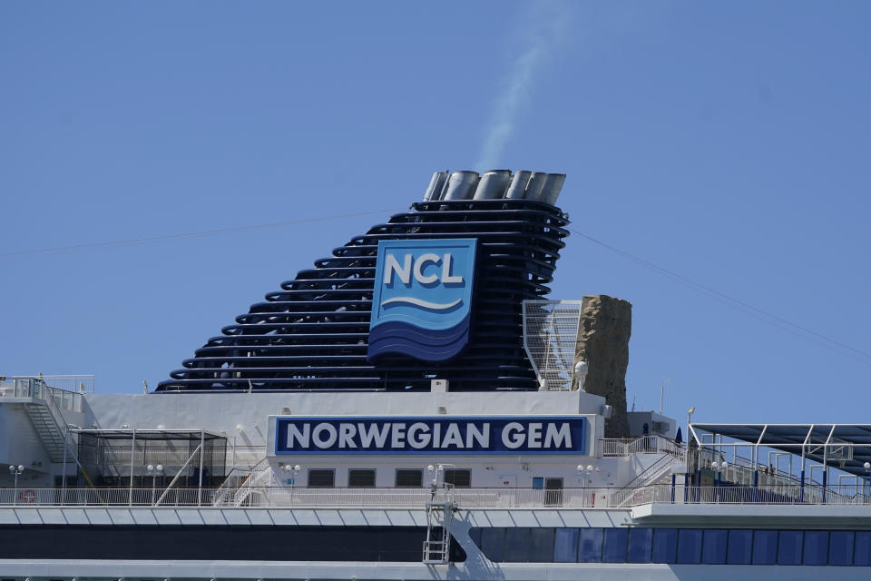 The smokestack of Norwegian Gem cruise ship is shown as it is docked, Monday, Aug. 9, 2021, at PortMiami in Miami. A federal judge has temporarily blocked a Florida law that prevents cruise lines from requiring passengers to prove they're vaccinated against COVID-19. Judge Kathleen Williams says it fails to protect people even as it appears to violate the free speech rights of cruise lines. She says Norwegian Cruise Lines has shown that without proof of vaccination, cruising will jeopardize public health by potentially causing "super-spreader" events wherever passengers disembark. (AP Photo/Wilfredo Lee)