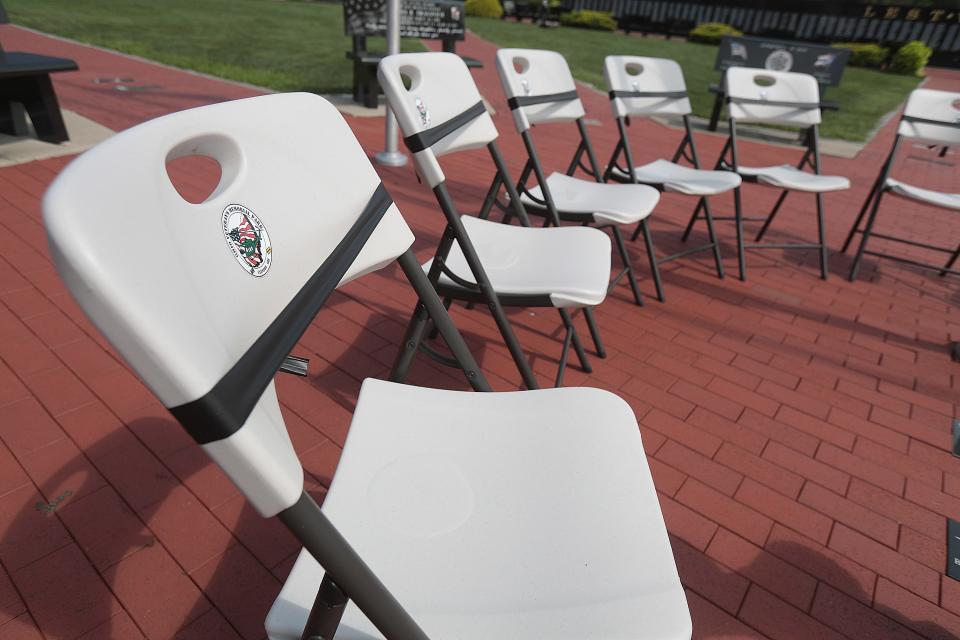 A display of empty chairs at the Ohio Veterans' Memorial Park in Clinton.