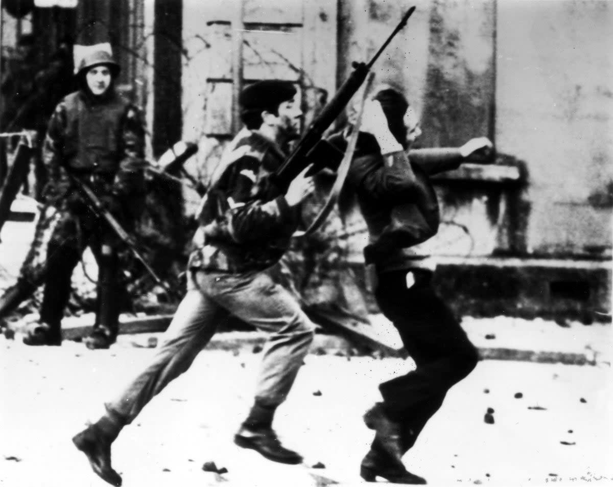 A British paratrooper takes a youth from the crowd on Bloody Sunday (Getty Images)