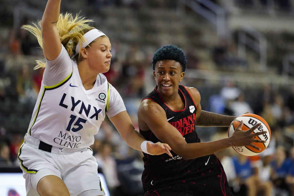 Indiana Fever guard Danielle Robinson (3) drives on Minnesota Lynx guard Rachel Banham (15) in the first half of a WNBA basketball game in Indianapolis, Friday, July 15, 2022. (AP Photo/Michael Conroy)
