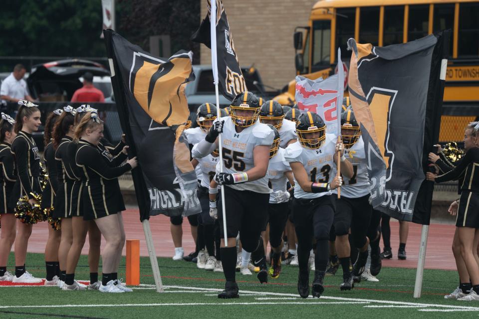 West Milford takes the field. West Milford and Nutley battle on the field at the Grasso Classic in Washington Township, NJ on Friday Aug. 25, 2023. Final Score, West Milford wins 37-0