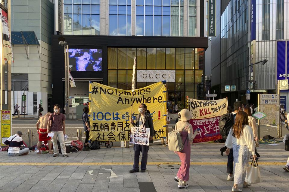 Protesters stage a rally against Japan’s Sapporo 2030 Olympics bid, in Shinjuku district of Tokyo, Japan, Sunday, June 12, 2022. Holding “No Olympics” banners, protesters demanded Japan drop its bid for the 2030 Winter Games Sunday.