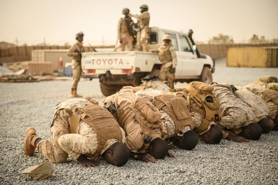 Nigerien EFoN soldiers pray at the team’s camp near Ouallam before heading out for another round of training, March 8, 2022.