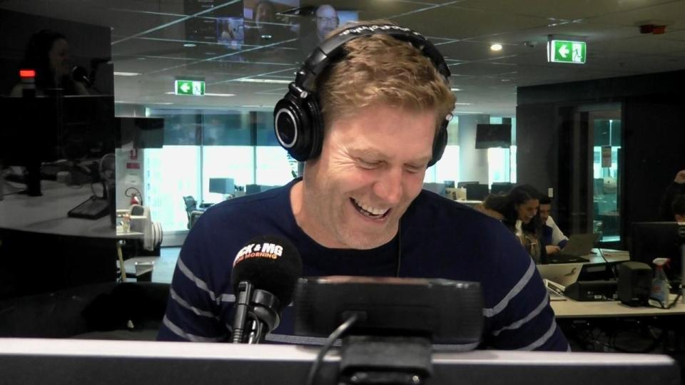 Dr Chris Brown on radio wearing a navy top