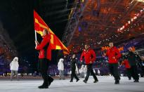 Macedonia's flag-bearer Darko Damjanovski leads his country's contingent during the opening ceremony of the 2014 Sochi Winter Olympic Games February 7, 2014. REUTERS/Brian Snyder (RUSSIA - Tags: SPORT OLYMPICS)