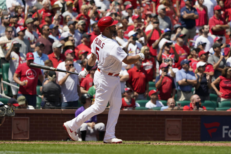 St. Louis Cardinals' Albert Pujols watches his grand slam during the third inning of a baseball game against the Colorado Rockies Thursday, Aug. 18, 2022, in St. Louis. (AP Photo/Jeff Roberson)