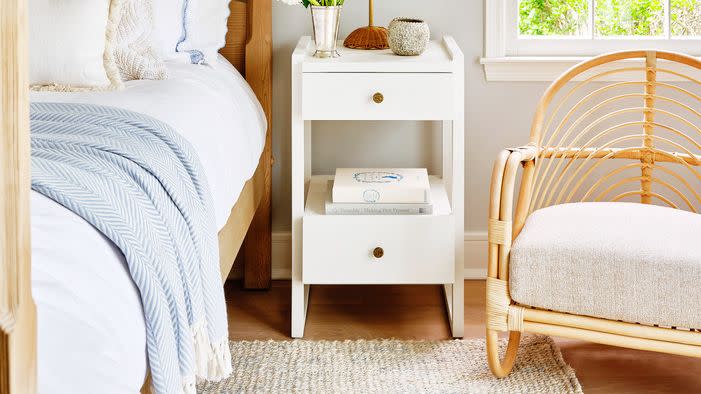 guest room with window treatment in a botanical schumacher fabric bedroom, roman shade modern colors and cool decor in a charming east hampton bungalow home designer ryann swan