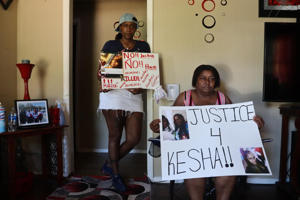 Audrey Tate, left, and Beverly Wray, right, hold signs for their late niece on Thursday, Sept. 1, 2022 in Gaffney, S.C. The South Carolina family is seeking justice for Kesha Tate killed by her neighbor who was intoxicated and making target practice in his backyard. Nicholas Skylar Lucas is accused of murder in the shooting death of Tate after crime scene technicians debunked his claim that the shots ricocheted off his target.(AP Photo/James Pollard)