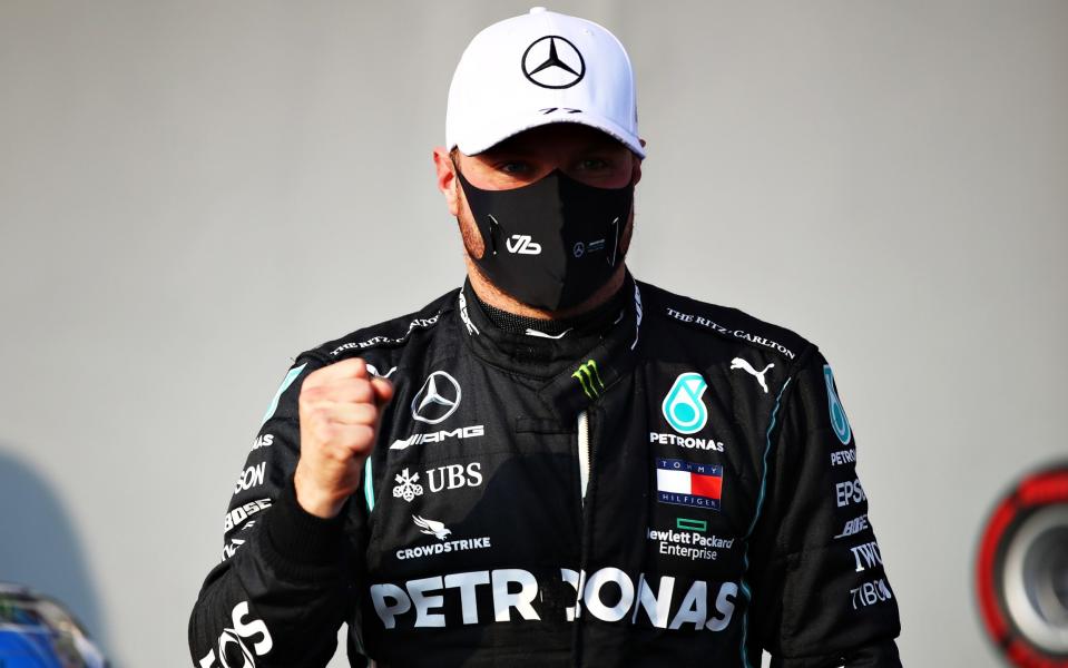 Pole position qualifier Valtteri Bottas of Finland and Mercedes GP celebrates in parc ferme during qualifying ahead of the F1 Grand Prix of Emilia Romagna at Autodromo Enzo e Dino Ferrari on October 31, 2020 in Imola, Ital - Mark Thompson /Getty Images Europe 