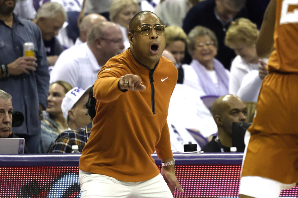 Texas head coach Rodney Terry directs this team against TCU during the first half of an NCAA college basketball game in Fort Worth, Texas, Saturday, Feb. 3, 2024. (AP Photo/Michael Ainsworth)