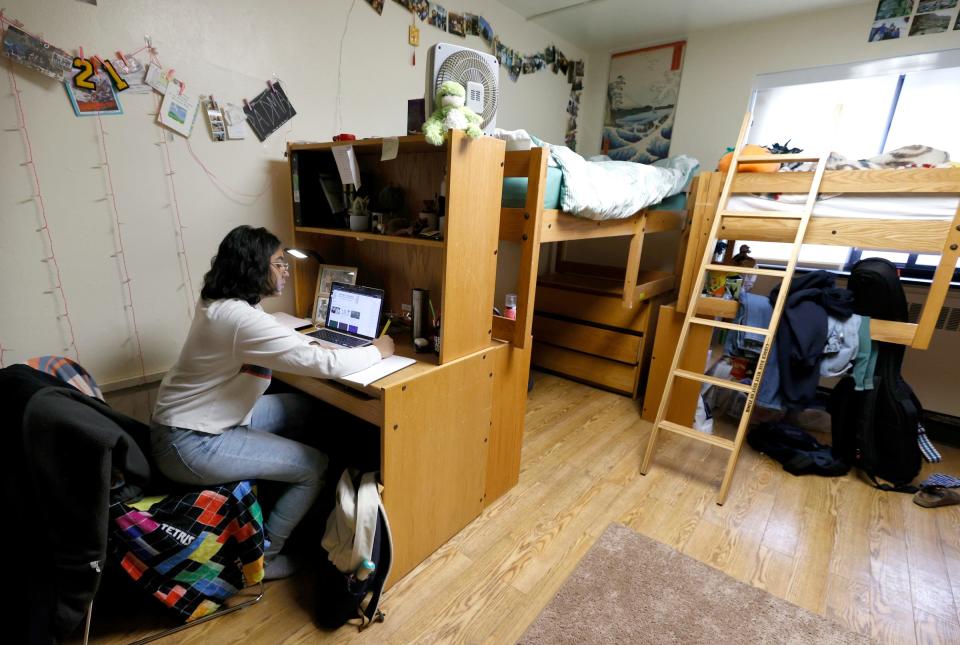 University of Michigan freshman Padma Danturty, 19, works on history homework in her dorm room on Saturday, Feb. 12, 2022. Danturty is a u0022documented dreamer,u0022 a child of legal immigrants on temporary work visas who have lived in the U.S. for most of their lives, but may have to leave the country upon turning 21.
