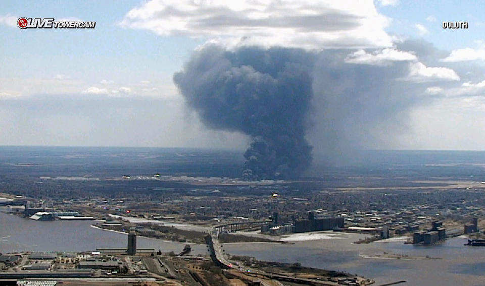 FILE - This image from video provided by WDIO-TV in Duluth, Minn., shows smoke rising from the Husky Energy oil refinery after an explosion and fire, April 26, 2018, at the plant in Superior, Wis. Wisconsin's only oil refinery is on track to be fully operational in June 2023 after a $1.2 billion effort to rebuild the facility five years following an explosion. The 2018 explosion and subsequent fires at the facility then-owned by Calgary-based Husky Energy in Superior injured three dozen workers and fears of a hydrofluoric acid leak caused 2,500 people in the city to evacuate. (WDIO-TV via AP, File)