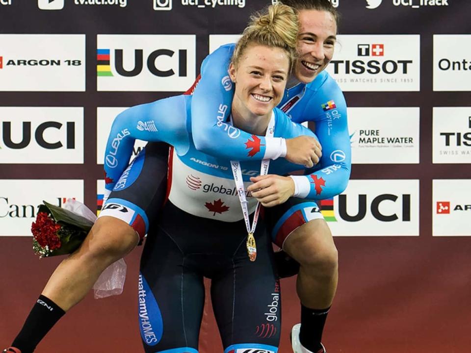 Kelsey Mitchell, left, and Lauriane Genest pictured in 2020 after winning women's team sprint gold at track cycling's World Cup. They're on the medal hunt again this weekend at the Nations Cup in Milton, Ont., where over 300 athletes from 50 countries will compete. (Nathan Denette/Canadian Press/File - image credit)