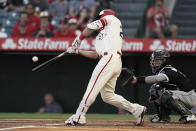 Los Angeles Angels' Mike Trout hits an RBI double against the Chicago White Sox during the first inning of a baseball game Wednesday, June 29, 2022, in Anaheim, Calif. (AP Photo/Jae C. Hong)