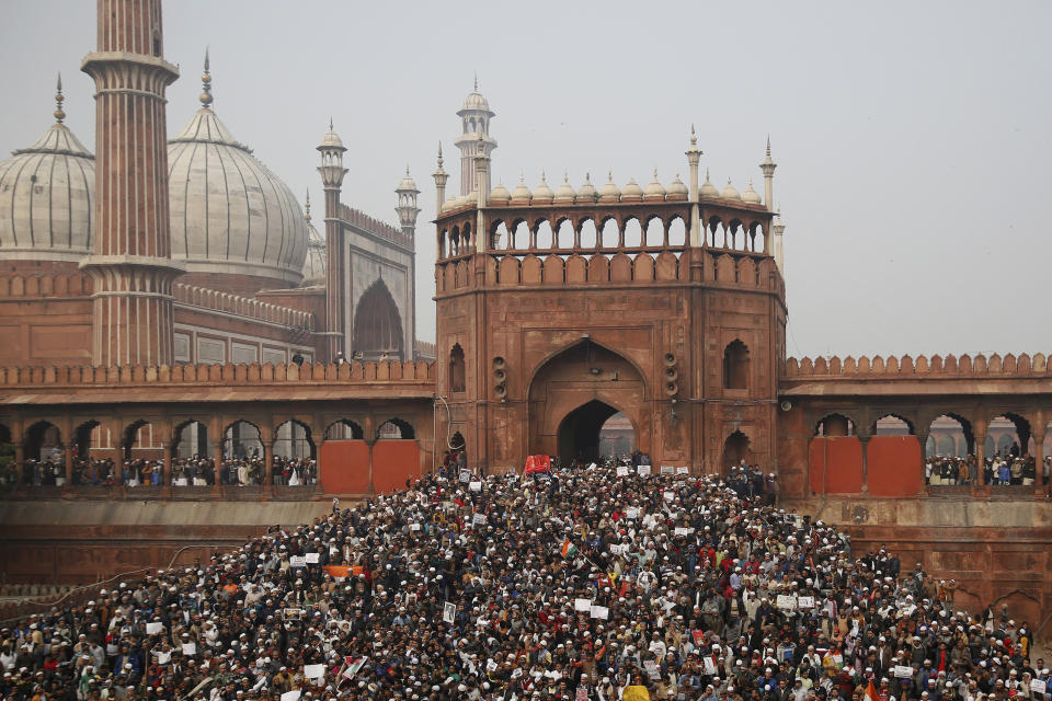 People gather for a protest against the Citizenship Amendment Act after Friday prayers outside the Jama Masjid in New Delhi, India, Friday, Dec. 20, 2019. Police banned public gatherings in parts of the Indian capital and other cities for a third day Friday and cut internet services to counter growing protests against a new law that critics say marginalizes Muslims. (AP Photo/Altaf Qadri)