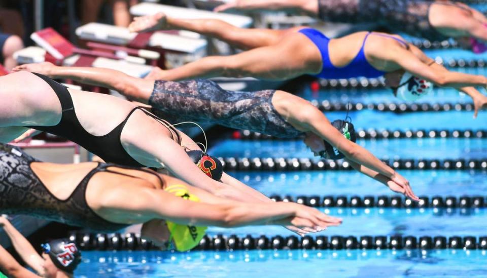 Swimmers compete in the Girls 400 Yard Freestyle Relay at the Clovis West Invitational Saturday, April 15, 2023 in Fresno. Clovis Unified’s Olympic Swim Complex at Clovis West opened this week after being closed almost a year for renovation and construction. ERIC PAUL ZAMORA/ezamora@fresnobee.com