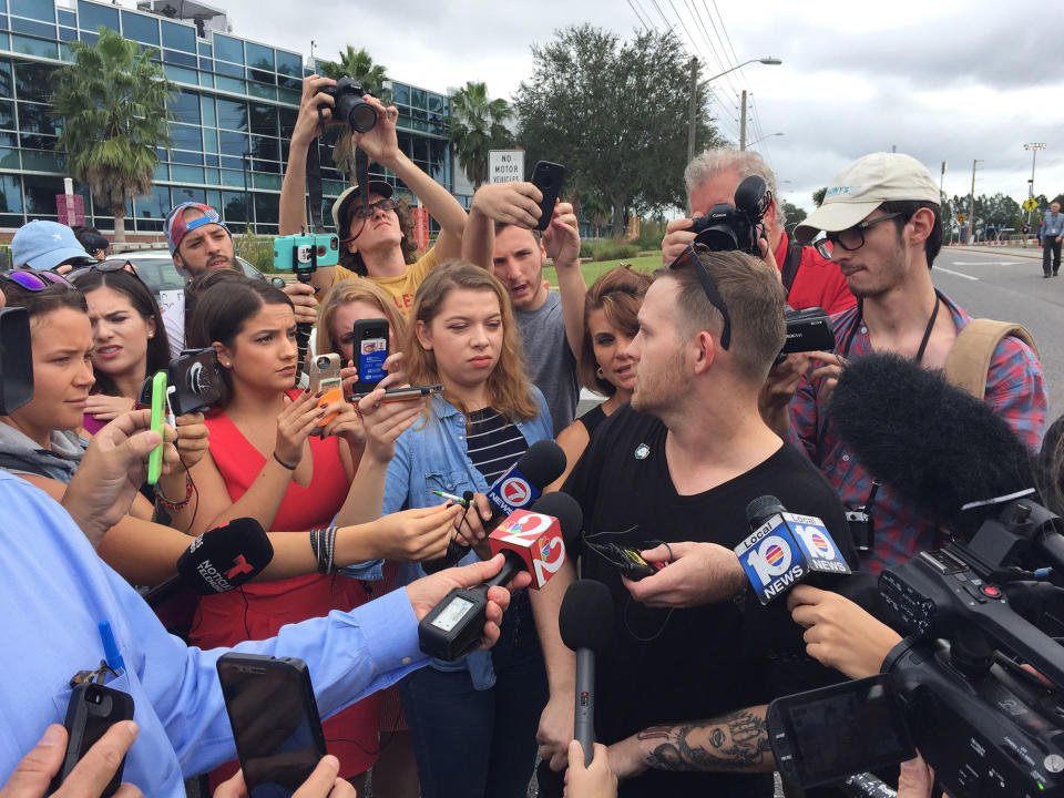 <p>October 19, 2017 – Gainesville, FL, USA – Sam Hyde of Houston, Texas, who is wearing a Nazi SS pin on his shirt, talks to the media prior to scheduled speech by white nationalist Richard Spencer at the University of Florida Thursday, Oct. 19, 2017 in Gainesville, Fla. (Photo: Ricardo Ramirez-Buxeda/TNS via ZUMA Wire) </p>