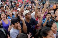 People shout during a protest over food shortage and against Venezuela's government in Caracas, Venezuela June 14, 2016. REUTERS/Marco Bello